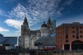 Dramatic sky over historic city buildings with modern architecture in the foreground in Liverpool, UK Royalty Free Stock Photo