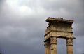 Dramatic sky over remaining piece of trabeation and columns of the ruins of the Temple of Apollo Sosiano, Roma, Italy