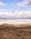 Dramatic sky over rolling hills of the Irish countryside.