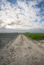 Country road below dramatic sky Royalty Free Stock Photo