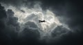 Dramatic sky with plane silhouette amidst dark storm clouds Royalty Free Stock Photo
