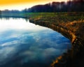 Dramatic sky reflections on park lake background