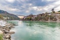 Dramatic sky at Rishikesh, holy town and travel destination in India. Colorful sky and clouds reflecting over the Ganges River.