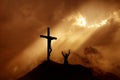 Dramatic sky scenery with a mountain cross and a worshiper Royalty Free Stock Photo