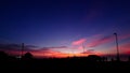 Dramatic sky with silhouette of street lamp at parking lot Royalty Free Stock Photo