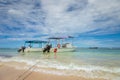 Dramatic sky over beach with motorboat, Negril Seven Mile Beach, Jamaica Royalty Free Stock Photo