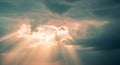 Sunbeams Breaking Through Dark Clouds in a Dramatic Sky light rays Royalty Free Stock Photo