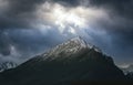 Dramatic sky with sunbeams breaking through heavy clouds over the Slavkovsky siit peak is the fourth highest mountain peak in Royalty Free Stock Photo