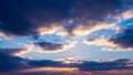 Dramatic Sunset Sky with Sun Rays Breaking Through Dark Clouds and Golden Light Keywords: sky, sunset, clouds, sun Royalty Free Stock Photo