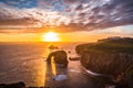 Dramatic sky at sunset with Enys Dodnan and the Armed Knight rock formations at Lands End Royalty Free Stock Photo