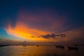 Dramatic sky, Sunset light shine above sea with fishing boat moored silhouette Royalty Free Stock Photo