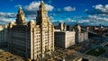 Dramatic skyline with historic buildings under a cloudy blue sky in Liverpool, UK Royalty Free Stock Photo