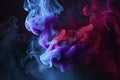 Dramatic smoke and fog in contrasting vivid red, blue, and purple colors. Vivid and intense abstract background Royalty Free Stock Photo