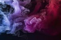 Dramatic smoke and fog in contrasting vivid red, blue, and purple colors. Vivid and intense abstract background Royalty Free Stock Photo