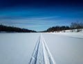 Dramatic snowmobile winter road landscape background Royalty Free Stock Photo