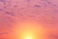 Dramatic soft sunrise, sunset with yellow sun and sunlight, pink violet sky with clouds background texture Royalty Free Stock Photo