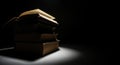 Stack of Old Books Illuminated by Dramatic Spotlight ancient vintage Royalty Free Stock Photo