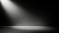 Dramatic spotlight illuminating a textured floor and dark background in a studio setting Royalty Free Stock Photo