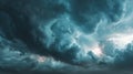 Dramatic Storm Clouds with a Glimmer of Light in a Teal Sky Royalty Free Stock Photo