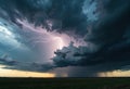 Dramatic storm clouds with lightning over a flat landscape create a powerful Royalty Free Stock Photo