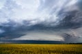 Dramatic storm clouds over a farm field Royalty Free Stock Photo