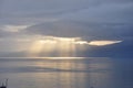 Dramatic stormy blue sky with sun goes through clouds Royalty Free Stock Photo