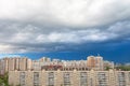 Dramatic stormy clouds over over the urban landscape of multi-storey buildings Royalty Free Stock Photo