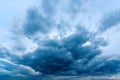 Dramatic stormy cumulus clouds at the sky in spring dusk Royalty Free Stock Photo