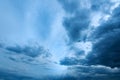 Dramatic stormy cumulus clouds at the sky in spring dusk Royalty Free Stock Photo