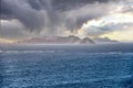 Dramatic stormy dark cloudy sky over sea, natural photo background Royalty Free Stock Photo