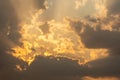 Dramatic stormy sunset with fiery glowing backlit clouds