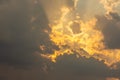 Dramatic stormy sunset with fiery glowing backlit clouds