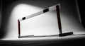 Dramatic studio shot of an athletic hurdle with red supports, symbolizing challenge and overcoming obstacles Royalty Free Stock Photo