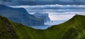 Dramatic summer scene of popular tourist attraction - Risin og Kellingin cliffs, Kallur Lighthouse location, Kalsoy island. Panora Royalty Free Stock Photo