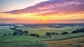 Dramatic summer sunrise. Panorama misty landscape. Foggy Morning on river aerial view. Green fields and meadows