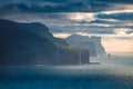 Dramatic summer view of popular tourist attraction - Risin og Kellingin cliffs. Gloomy morning scene of Eysturoy island, Atlantic