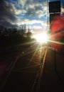 Dramatic sun flare on city road transportation back Royalty Free Stock Photo