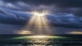 Dramatic Sun Rays Breaking Through Dark Clouds Over Ocean Royalty Free Stock Photo