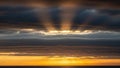 Dramatic Sun Rays Bursting Through Dark Storm Clouds Over Ocean Horizon crepuscular rays Royalty Free Stock Photo