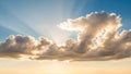 Dramatic sun rays piercing through fluffy white and golden clouds against a clear blue sky backdrop Keywords: sun Royalty Free Stock Photo