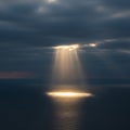 Dramatic Sunbeam on Dark Ocean Surface Royalty Free Stock Photo