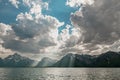 Dramatic sunbeams, clouds, and snowcapped mountains over Jackson Lake in Grand Teton National Park Royalty Free Stock Photo