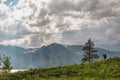 Dramatic sunbeams, clouds, and snowcapped mountains over Jackson Lake in Grand Teton National Park Royalty Free Stock Photo