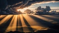 Dramatic sunbeams pierce dark storm clouds over a luminous landscape light rays Royalty Free Stock Photo