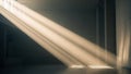 Dramatic Sunbeams Streaming Through a Dark, Empty Room with Concrete Walls light shadow Royalty Free Stock Photo