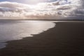 Dramatic Sunlight Reflection on Sandymount Beach Shoreline at Low Tide, Dublin Royalty Free Stock Photo