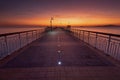Dramatic sunrise on the beach in Burgas, Bulgaria. Sunrise on the Burgas Bridge. Bridge in Burgas - symbol of the city Royalty Free Stock Photo