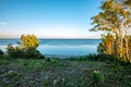 dramatic sunrise over the baltic sea with rocky beach and trees Royalty Free Stock Photo