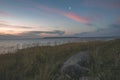 dramatic sunrise over the baltic sea with rocky beach and trees Royalty Free Stock Photo