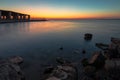 Dramatic sunrise with silky water view in Al uqair ruined fort sea side Saudi Arabia Royalty Free Stock Photo